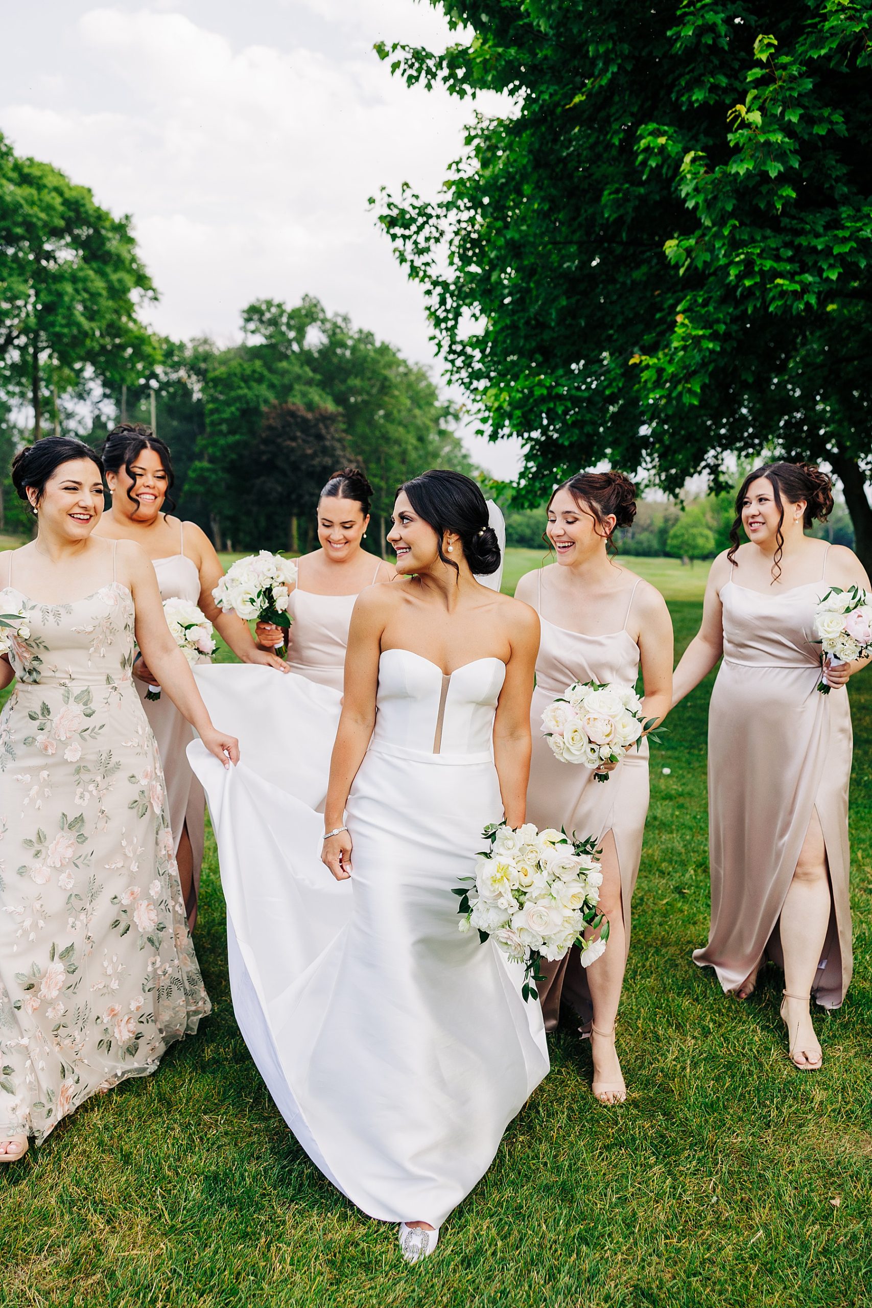 A bride with her bridesmaids after the wedding ceremony.