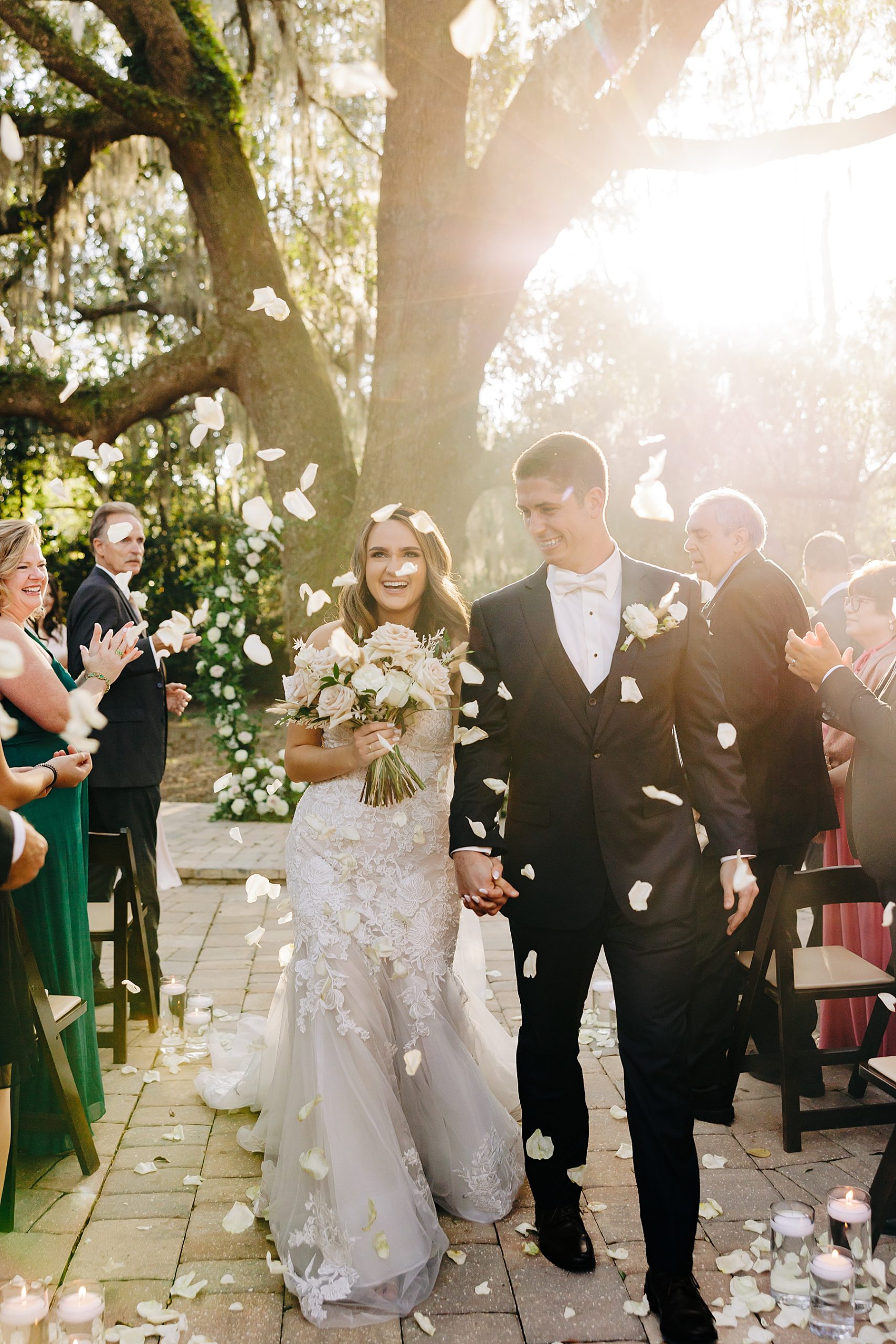 A bride and groom walking down the aisle.