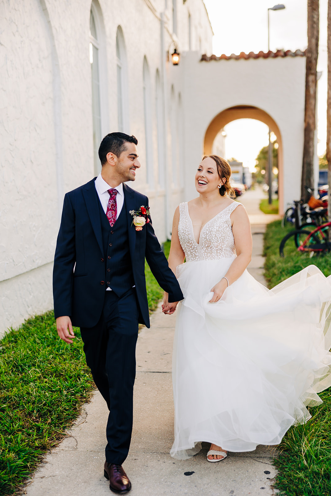 A bride and groom taking couple photos after their ceremony.